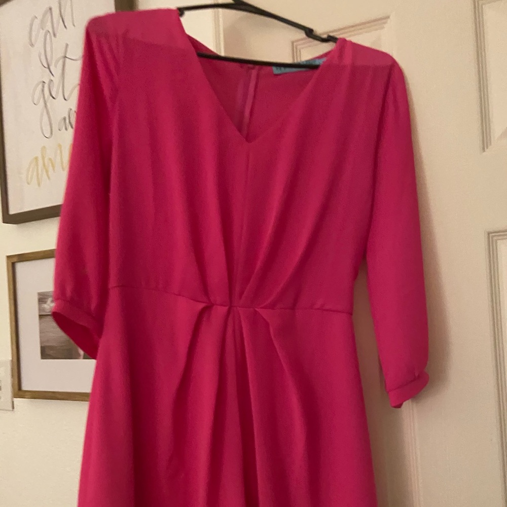 A pink long sleeve romper